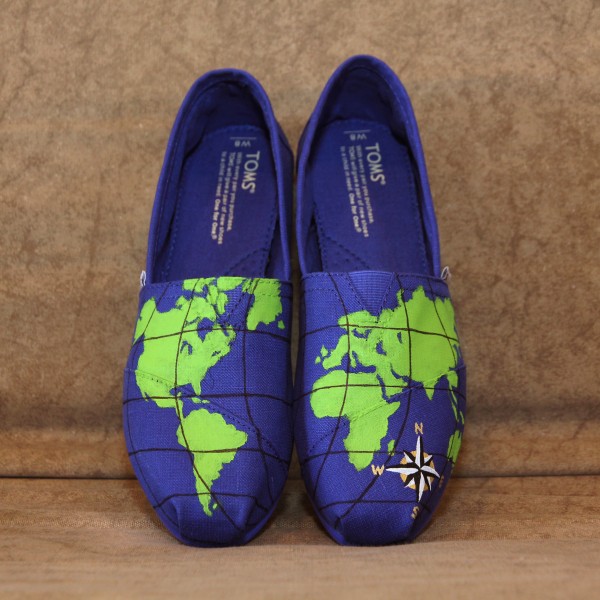 Custom, hand painted World Map TOMs shoes featuring a map of the world with a gold, black, and white compass.