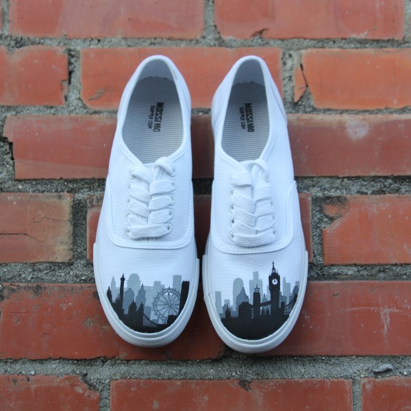Custom, hand painted London Skyline Vans featuring the London Eye, the Big Ben, and other building silhouettes visible in the London Skyline.