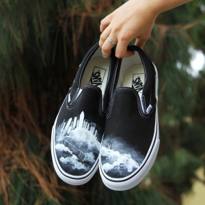 Custom, hand painted Cloud Castle Vans shoes featuring a mystical castle sitting amidst white clouds with a staircase leading down.
